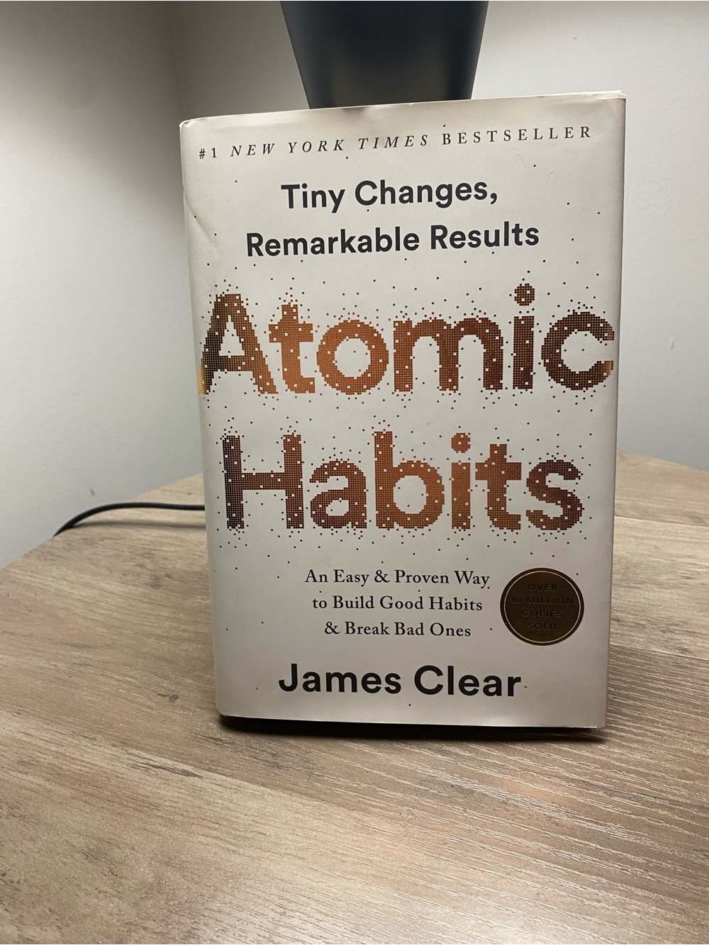 Atomic Habits by James Clear — White & Copper Hardcover